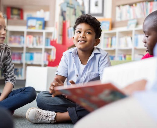 Multiethnic,Group,Of,Kids,Sitting,On,Floor,In,Circle,Around